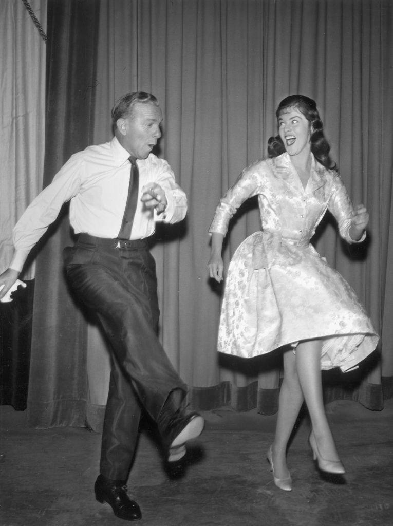 #30 Ann-Margret showing her dance step to American comedian George Burns, 1955.