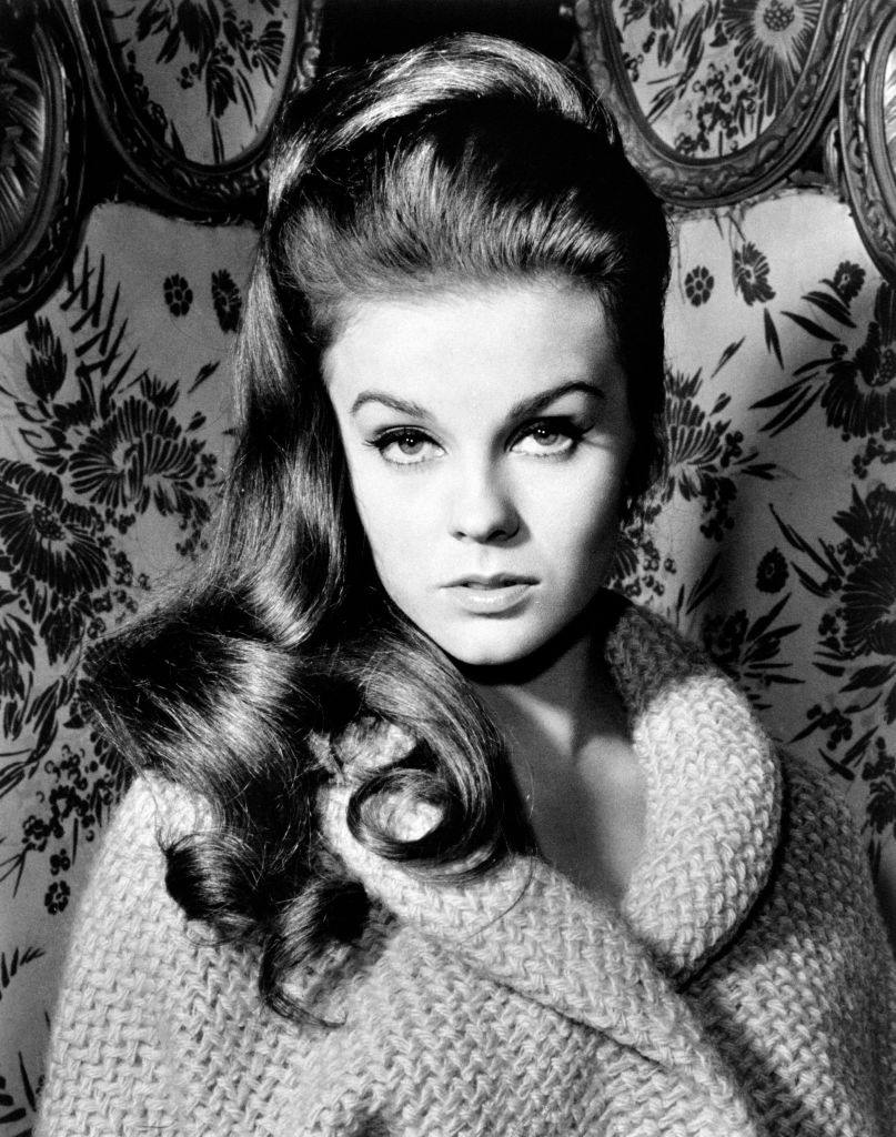 #31 Ann Margret dressing a bathrobe in front of a screen, 1955.