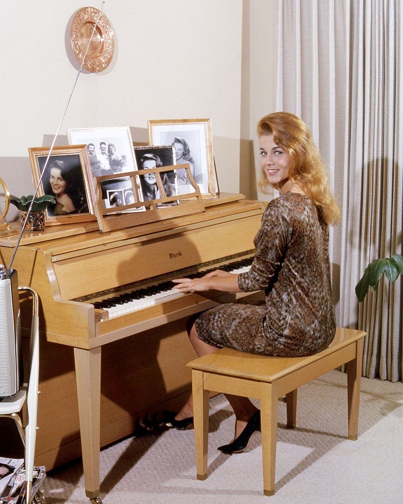 #28 Ann-Margret playing a piano, circa 1964.