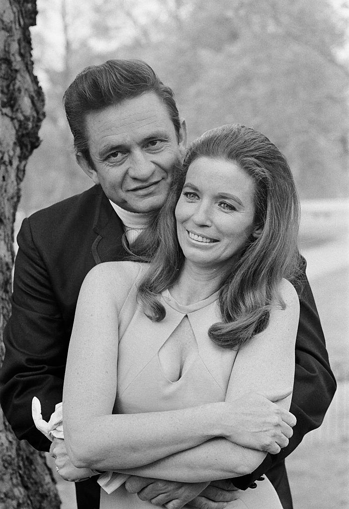 #44 Johnny Cash with his wife June Carter in a London park during their visit to Britai.