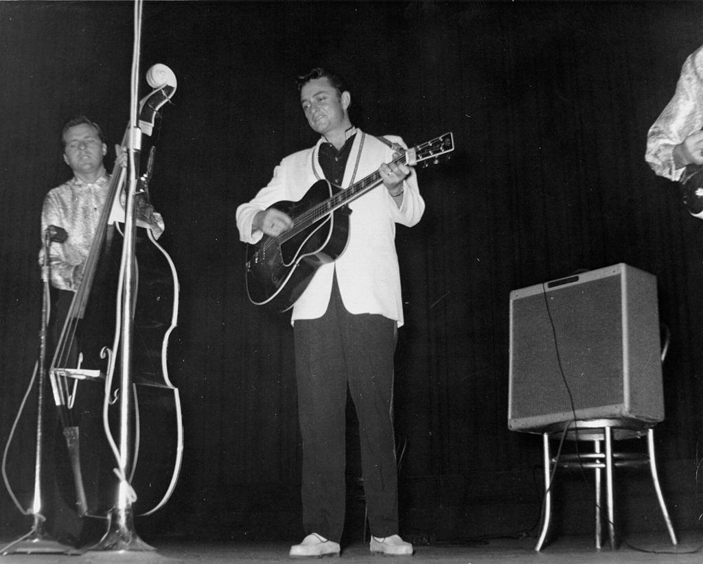 Johnny Cash performs onstage with his backing band “The Tennessee Two”, 1956.