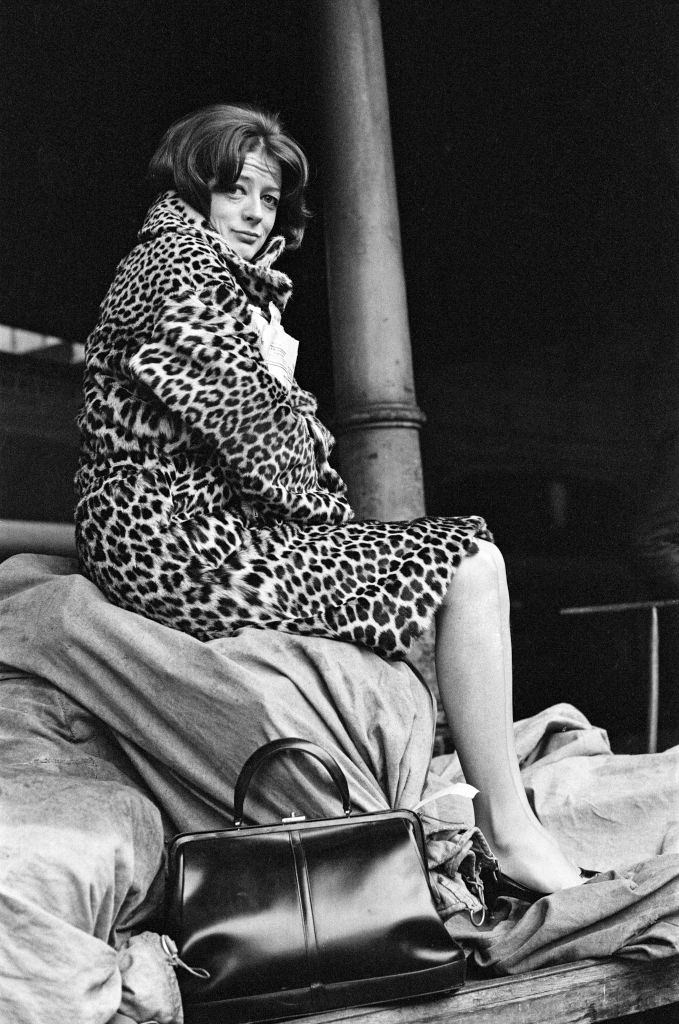 #14 Maggie Smith on a train station platform in London, 1964.