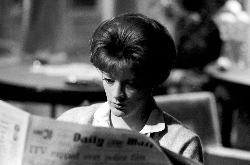 #19 Maggie Smith as Sarah Watkins reads the Daily Mail while on the set of the film ‘The Honey Pot’ circa 1967
