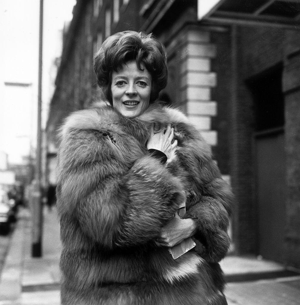 #32 Maggie Smith, wearing a fur coat, 1969.