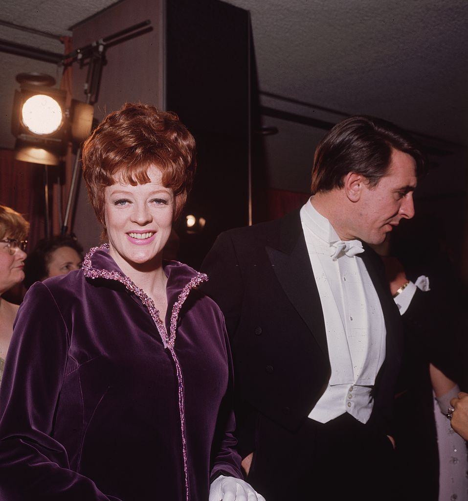 #34 Maggie Smith with her husband, Robert Stephens, at a Royal Film Performance in London, 1969.