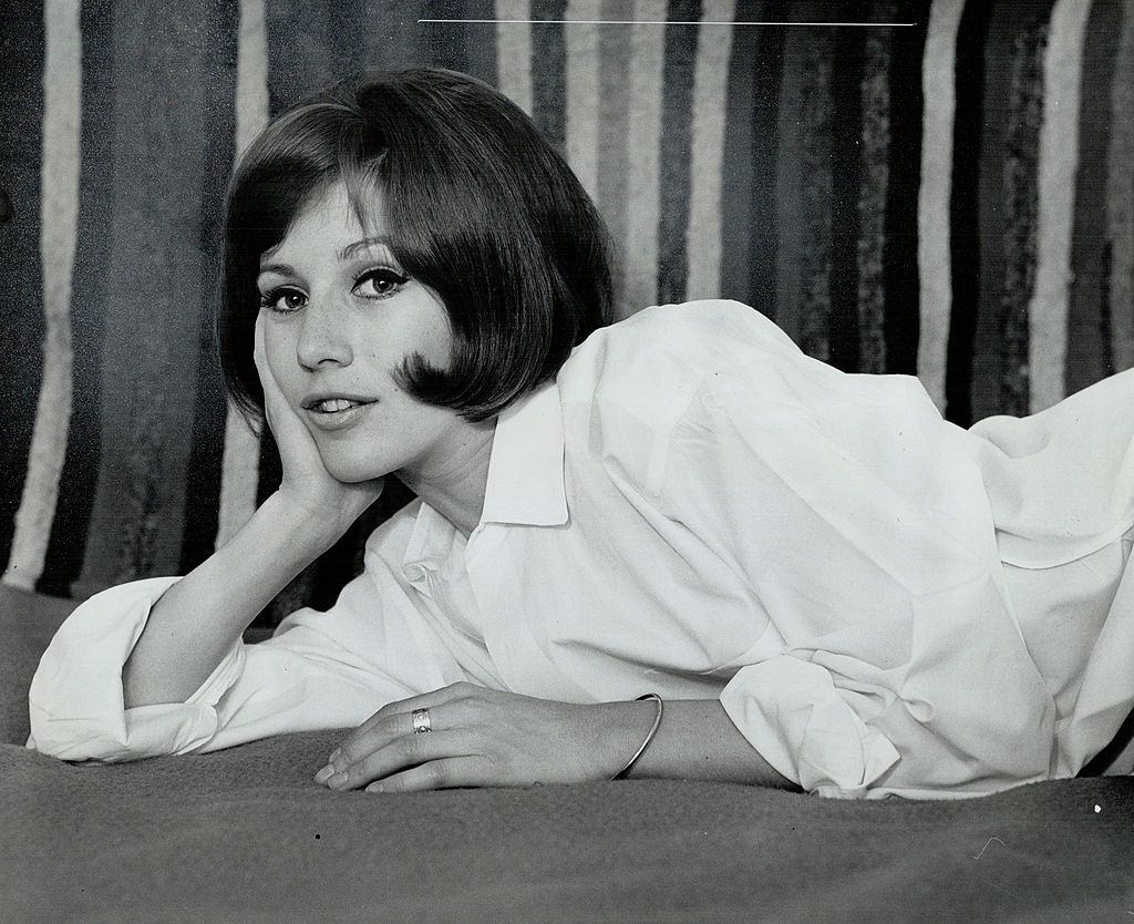 #46 Maggie Smith relaxing on the sofa, 1964.