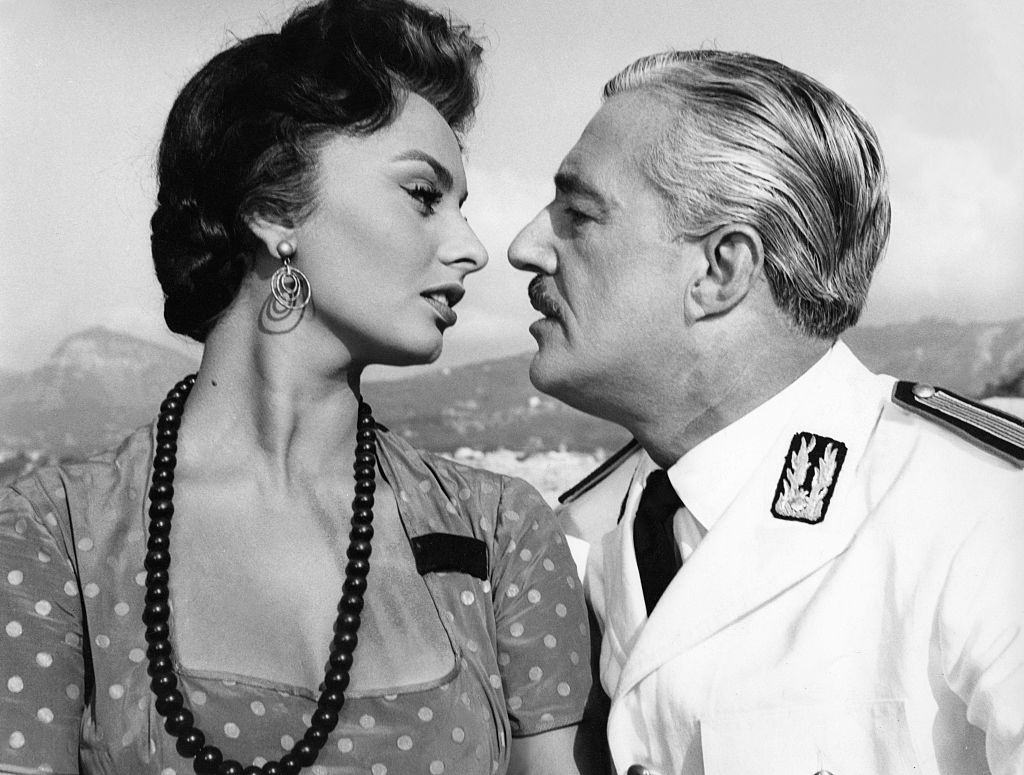 #61 Sophia Loren and Vittorio de Sica on the set of “Pain, Amour, Ansi Soit il”.