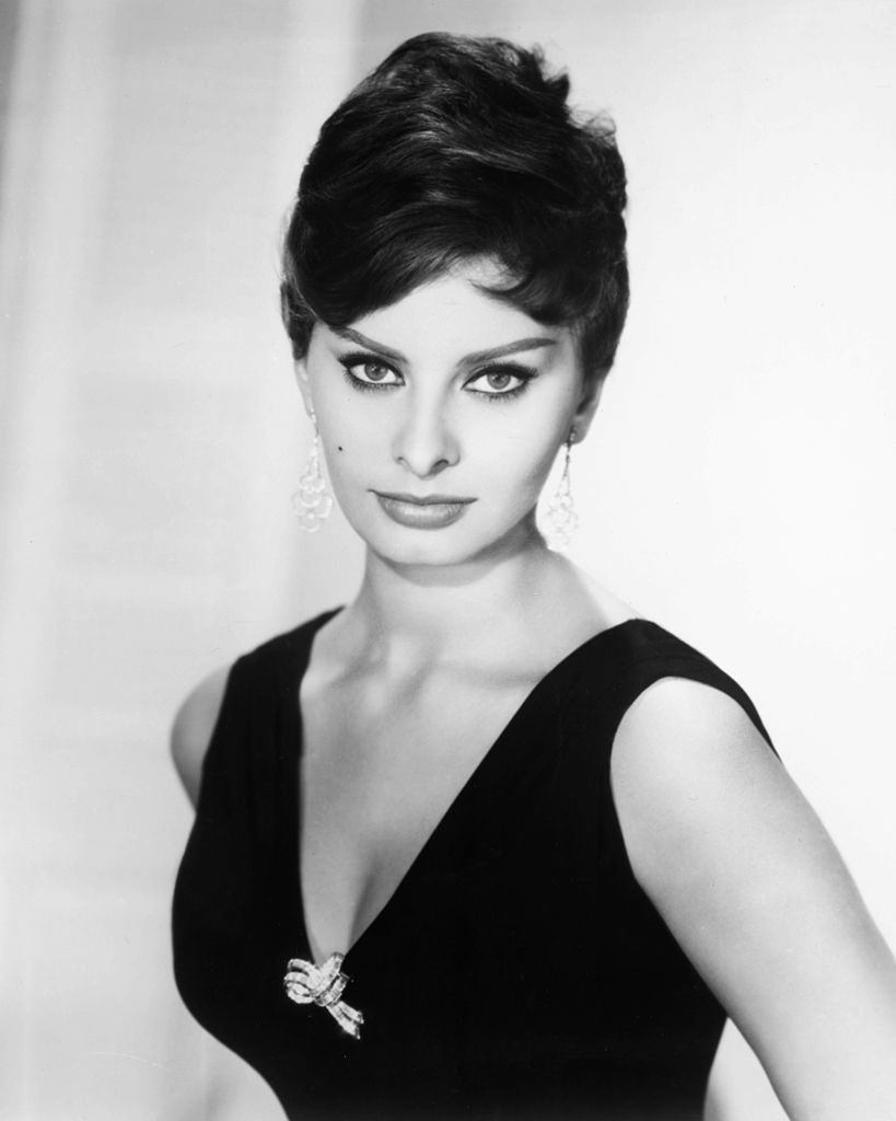 #11 Sophia Loren , wearing a sleeveless top, 1954.