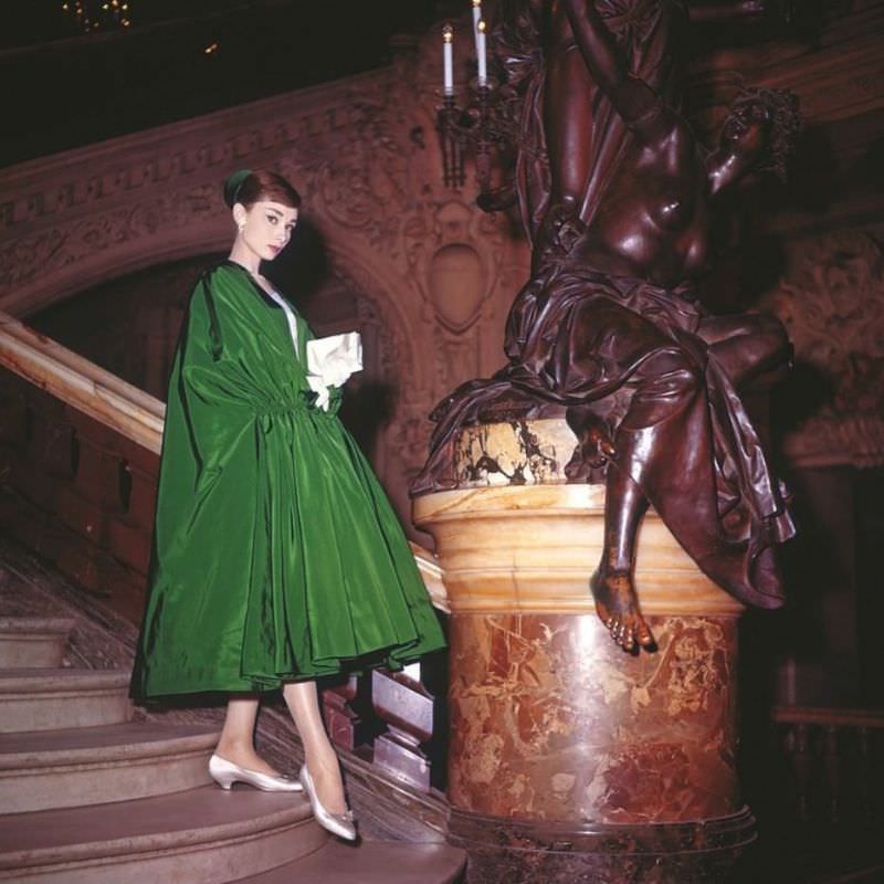 #1 Audrey Hepburn wearing a voluminous evening coat of rustling green taffeta