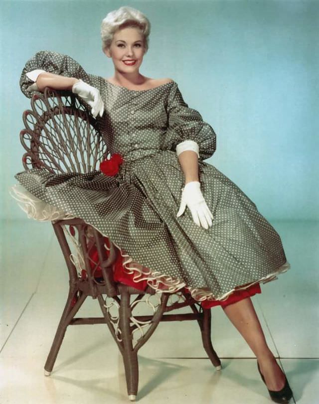 #11 Kim Novak is resplendent in a lightweight taffeta summer dress and gives all a lovely view of her petticoats