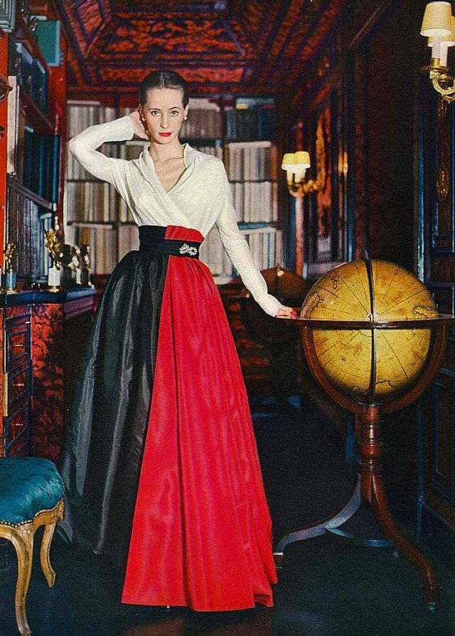 #18 Model in a soft shirt of silk organdie with a splash of red panels over a black taffeta skirt