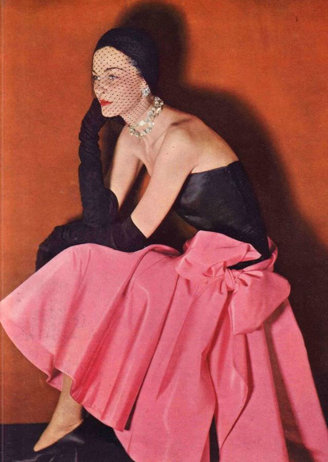 #19 Model in strapless silk taffeta dress designed by Norman Norell