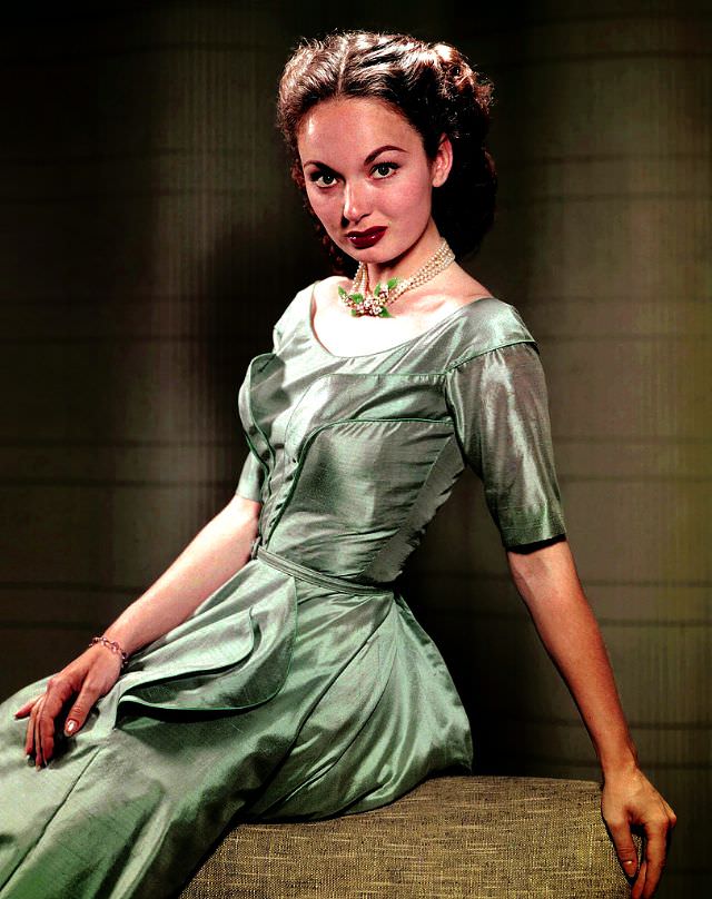 #2 Ann Blyth models a ravishing taffeta dress of seafoam green