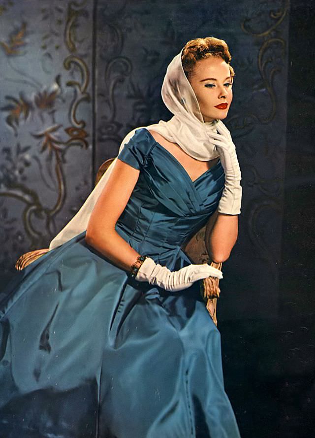 #21 Model wearing a peacock blue dress of Arnel taffeta