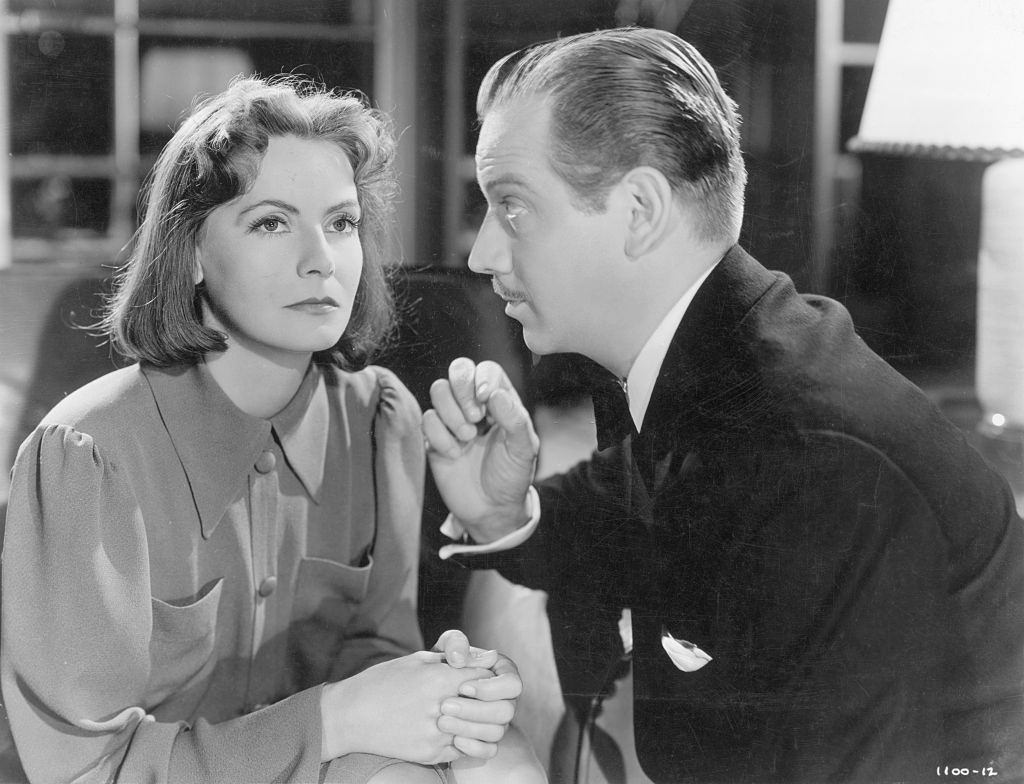#11 Greta Garbo listening to her co-star in the 1939 Metro-Goldwyn-Mayer production of “Ninotchka”.