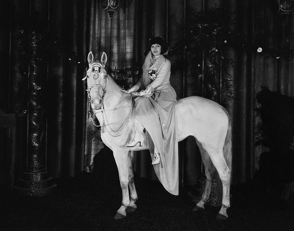 #16 Greta Garbo sitting on a horse, 1926.