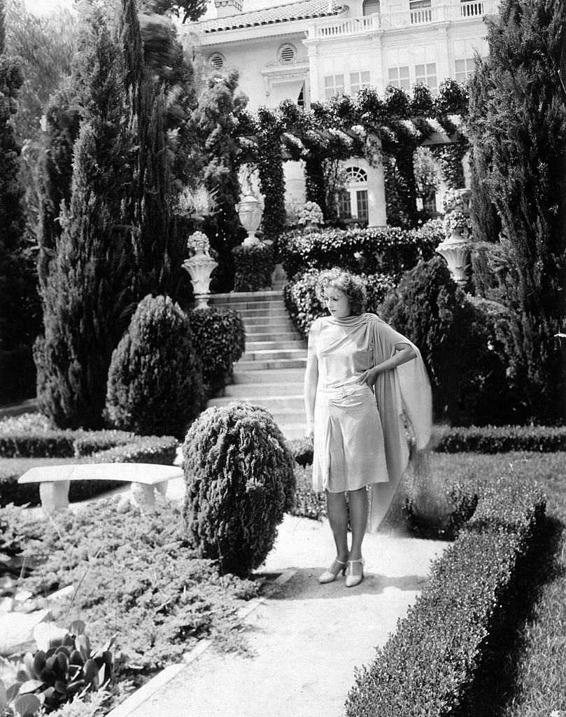 #26 Greta Garbo standing in the garden of her Hollywood villa. Los Angeles, 1920s