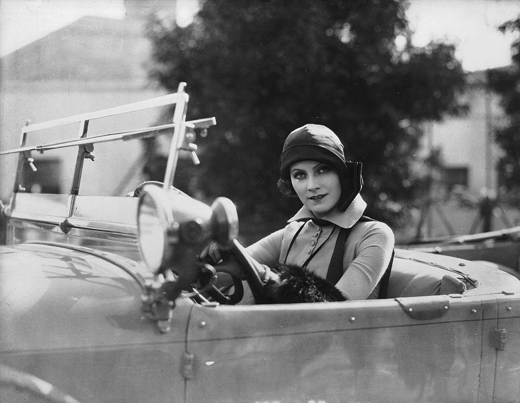 #56 Greta Garbo driving a car, 1925.