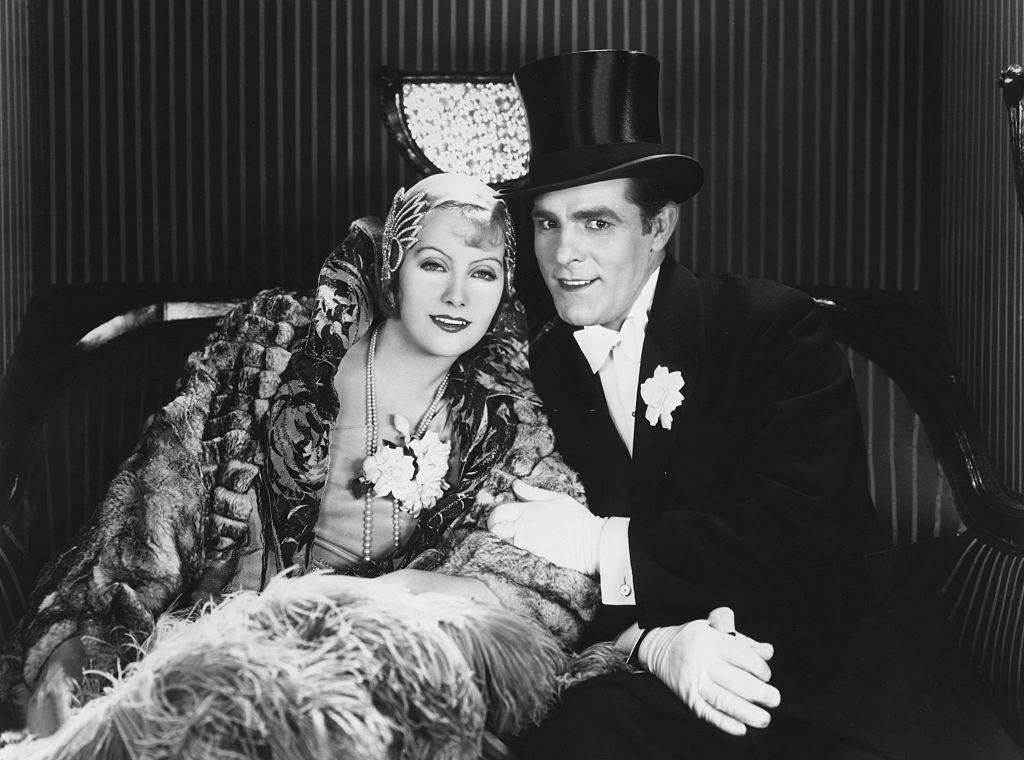 #66 Greta Garbo with actor Antonio Moreno on the set of “The Temptress”, 1924.