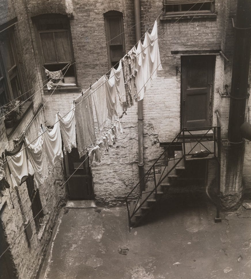 #3 View of clothesline strung between windows in brick courtyard, 1392 Madison Ave. ca. 1933. (Museum of the City of New York)