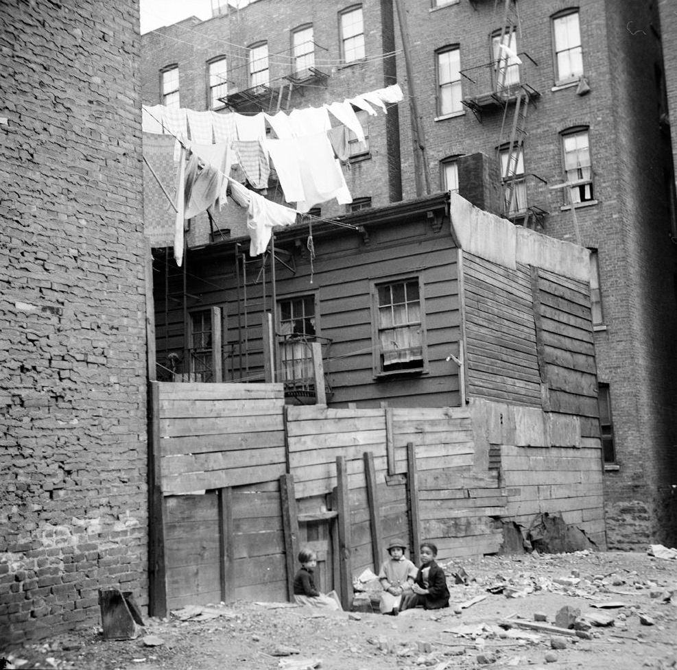 #8 Wooden Rear Tenements–Children Playing in Dirt. 1935. (Museum of the City of New York)