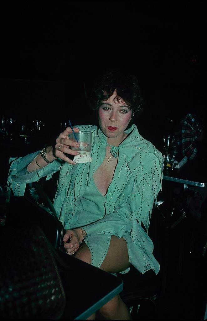 #43 Mackenzie Phillips enjoying her drink, 1989
