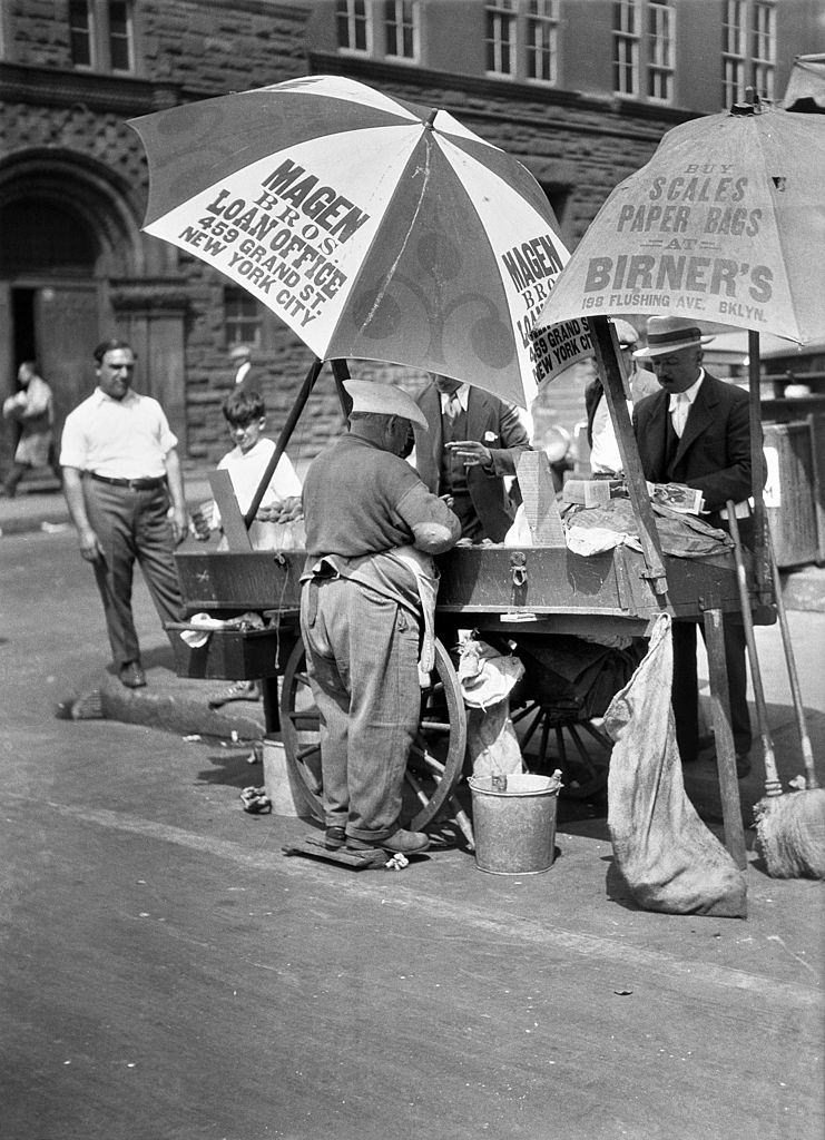 #59 An oyster vendor on the Lower East Side near Grand Street, New York City, 1930.