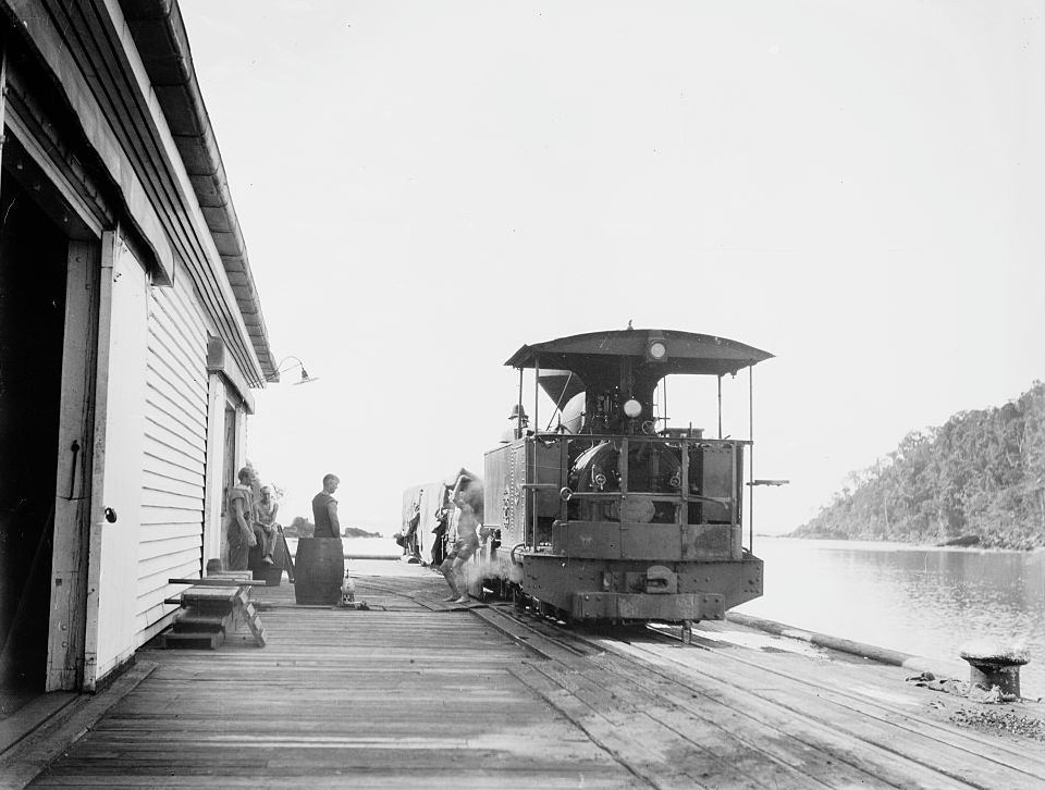 #9 Steam train loaded with sugar cane at a station in Queensland, 1930.