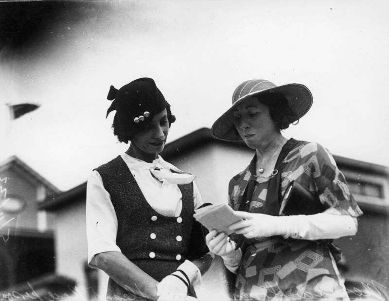 #39 Two women picking a winner at the Ascot Races, Brisbane, Queensland
