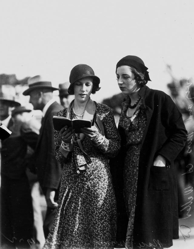 #41 Two young ladies picking a winner at Albion Park racecourse, Brisbane, Queensland
