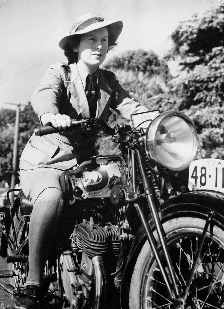 #48 Joan Grimes, Australian Women’s Emergency Legion, learns to ride a motorcycle, to fit her for the job as a dispatch rider, if needed, 1939.