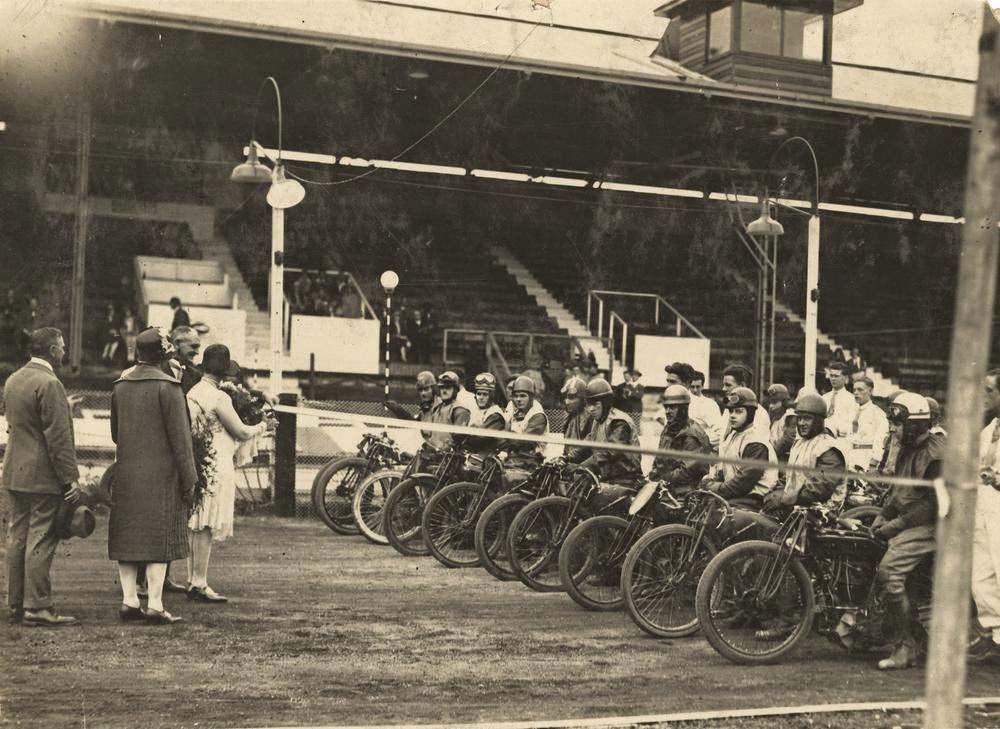 #51 Officials cutting the starting ribbon at a speedway motorcycle race in Brisbane, 1930.