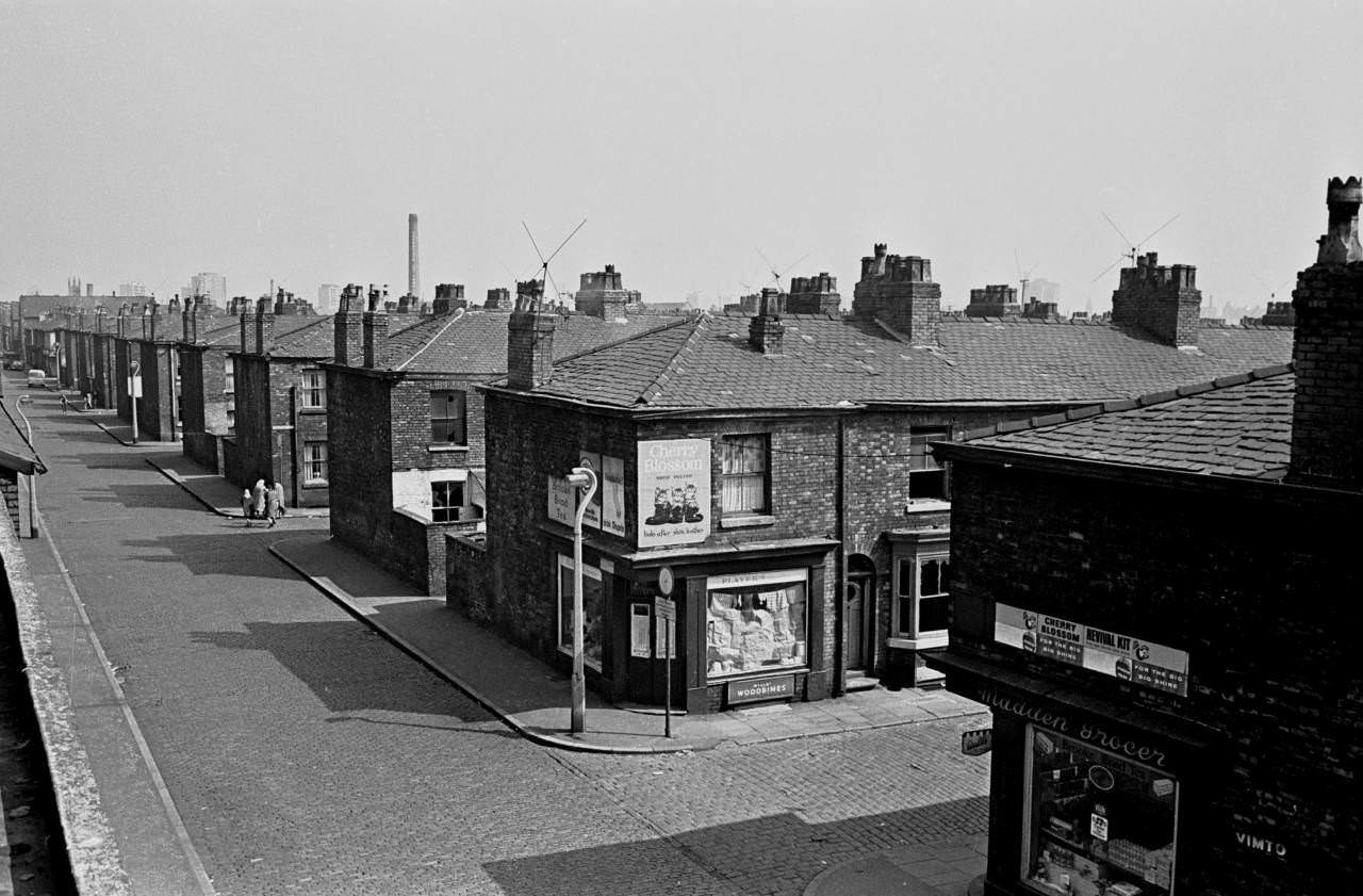 #14 Street scene and corner shops Salford 1970