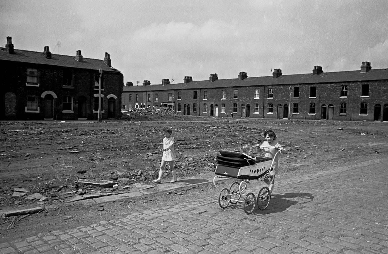 #17 Young girls take baby sister for a walk, Salford 1969