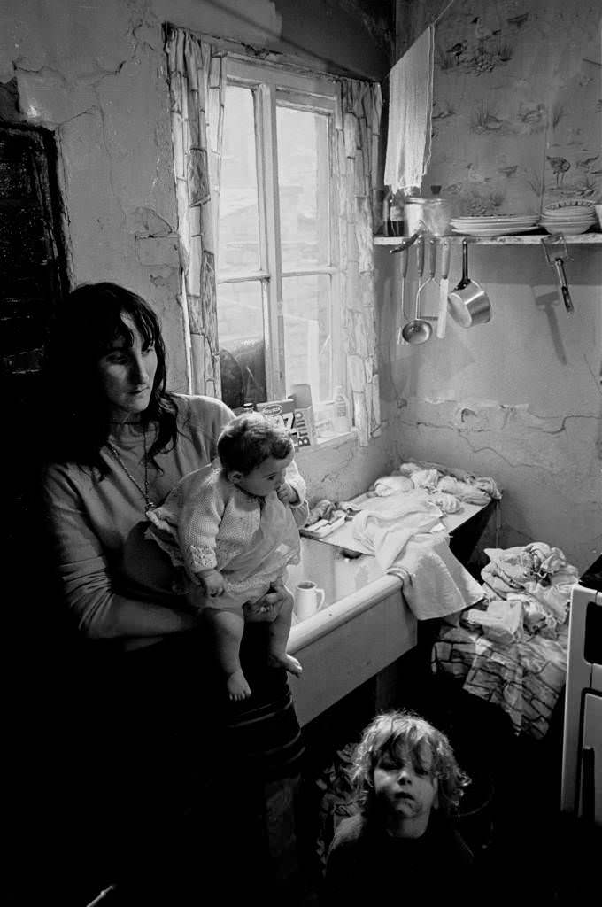 #1 Mother and children dealing with the washing Salford 1971