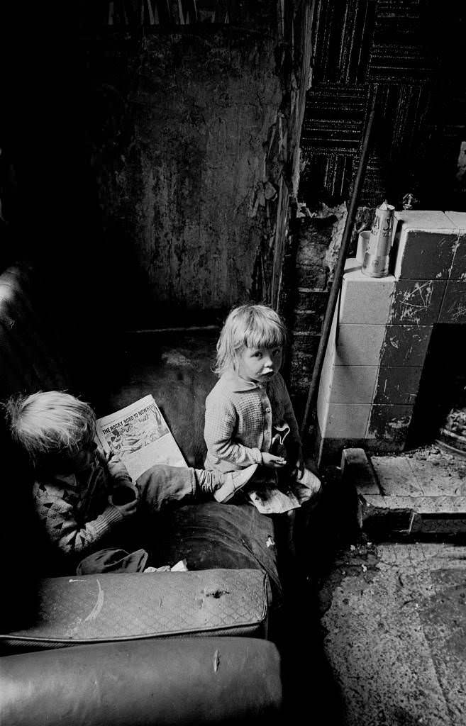#7 Children with comic in a Salford slum property 1971