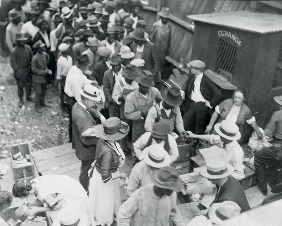 #4 Black residents of Tulsa line up to receive meals from good Samaritans on June 1, 1921.