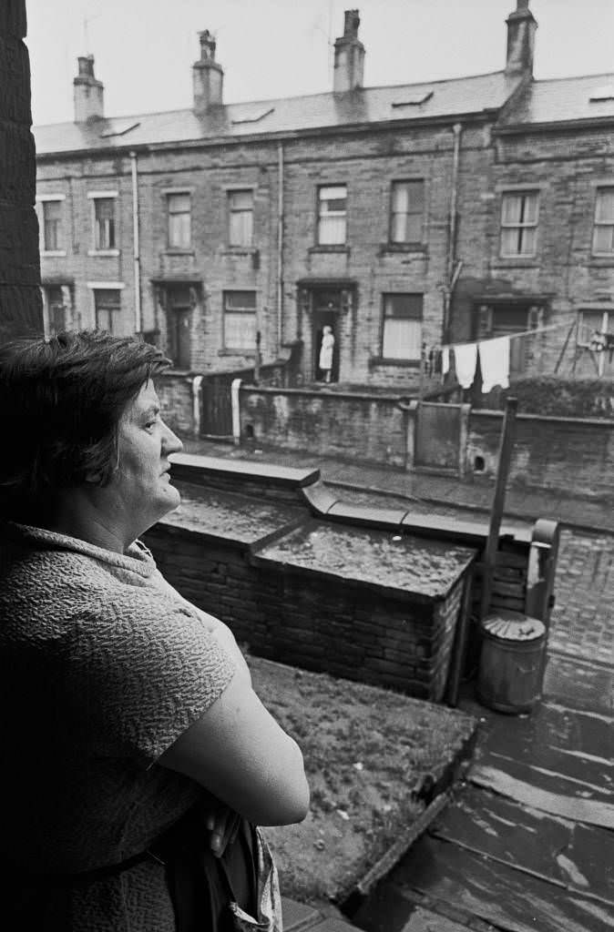 #18 Housewife in doorway of Bradford house, 1969