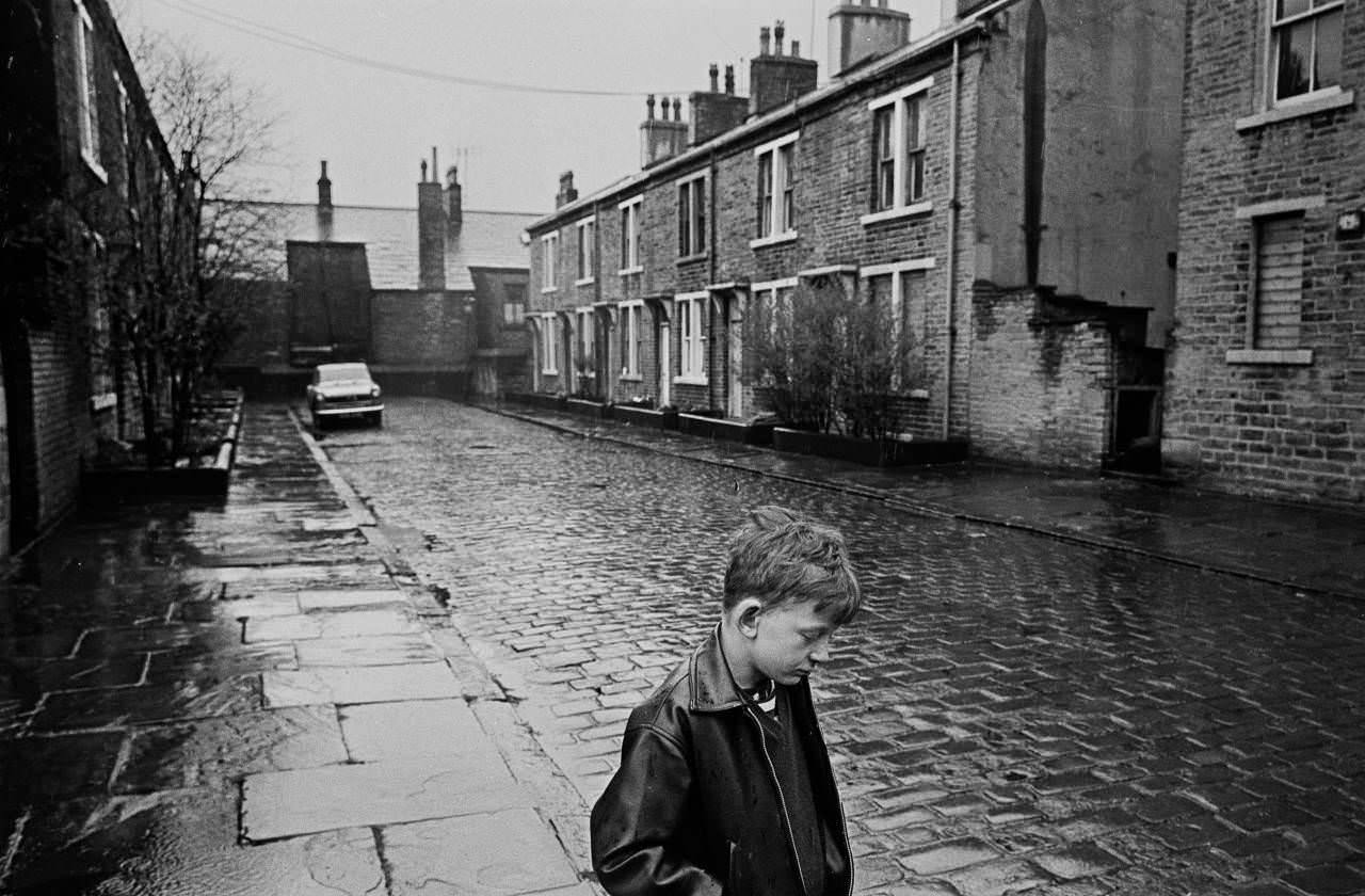 #23 Boy standing in the rain, Forster St Bradford, 1969