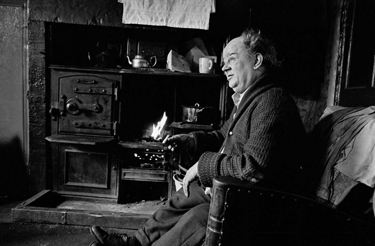 #27 Senior citizen by his hearth, Bradford, 1969