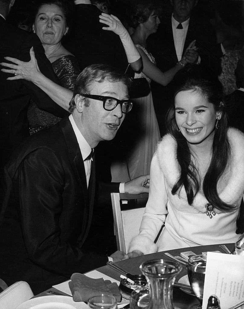 #25 Michael Caine talks with Geraldine Chaplin, Charlie Chaplin’s daughter, 1965.