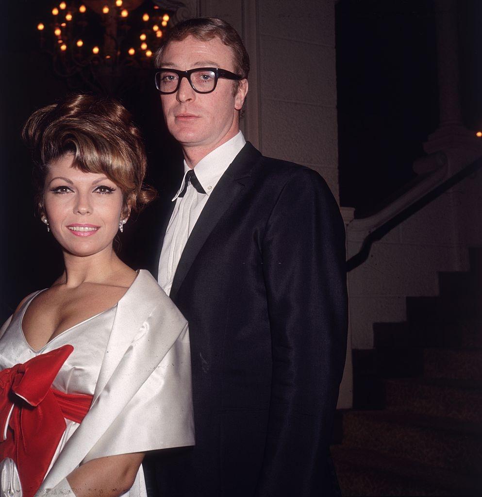 #26 Michael Caine with American pop singer Nancy Sinatra at the premiere party for Martin Ritt’s film, ‘The Spy Who Came in from the Cold’, 1965.
