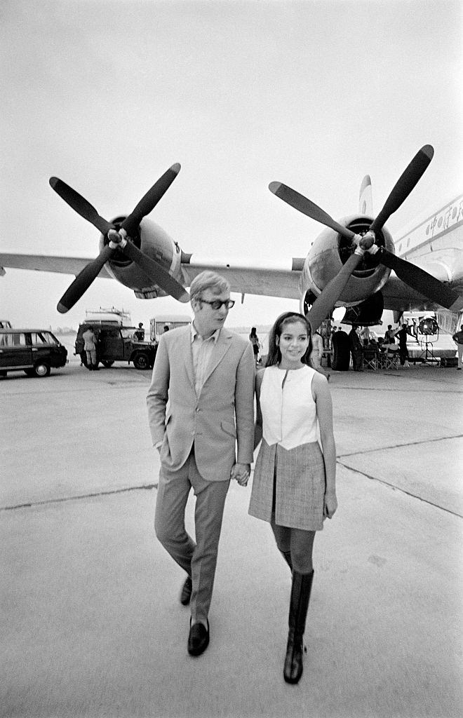 #48 Michael Caine with Bianca De Macias at Paris Orly Aiport, 1966.