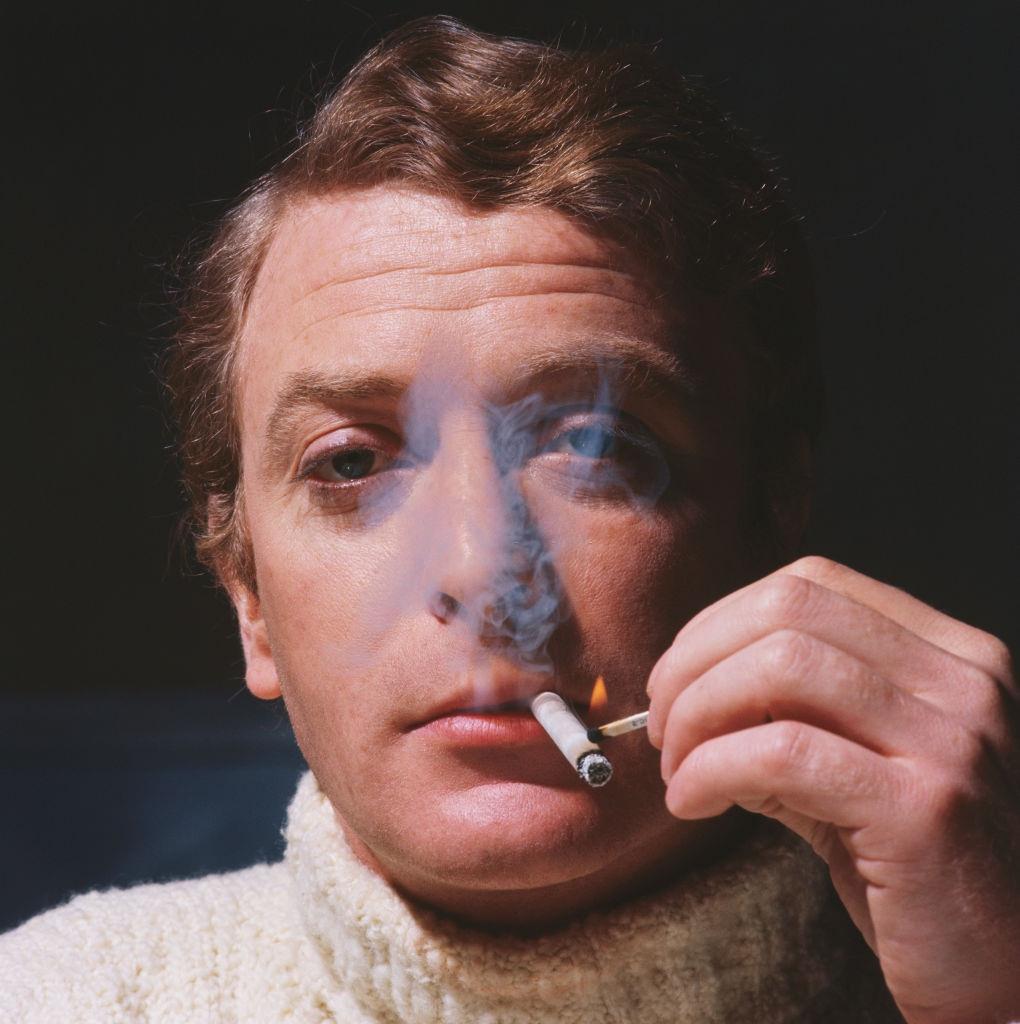 #65 Michael Caine lights a cigarette, 1967.