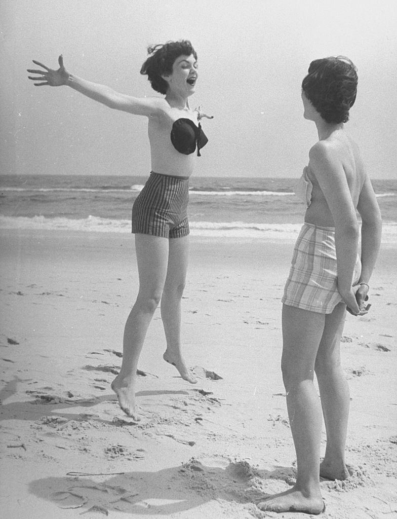 #5 Two woman wearning wearning the adhesive bra on the beach, 1949.