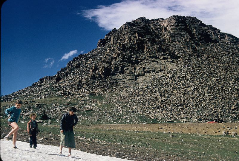 #5 Playing in the snow at Powder River Pass, Wyoming. June 1956