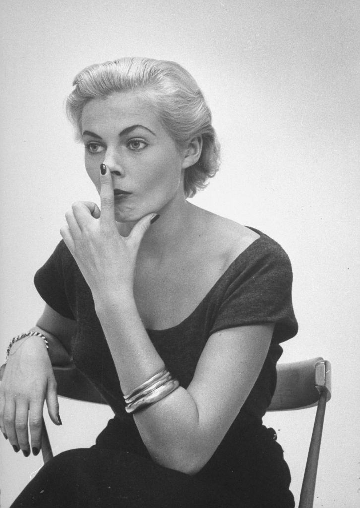 #16 Miss Sweden Anita Ekberg practicing the nose tilt for “Fish look” that Ford Model Agency head Eileen Ford suggested she must acquire to be a successful model in the US.