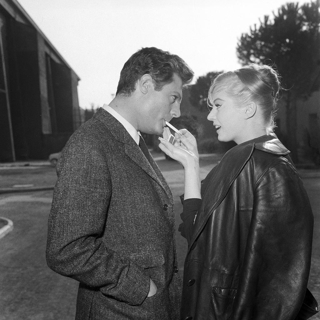 #28 Anita Ekberg with Marcello Mastroianni on the set of La Dolce Vita, 1954.