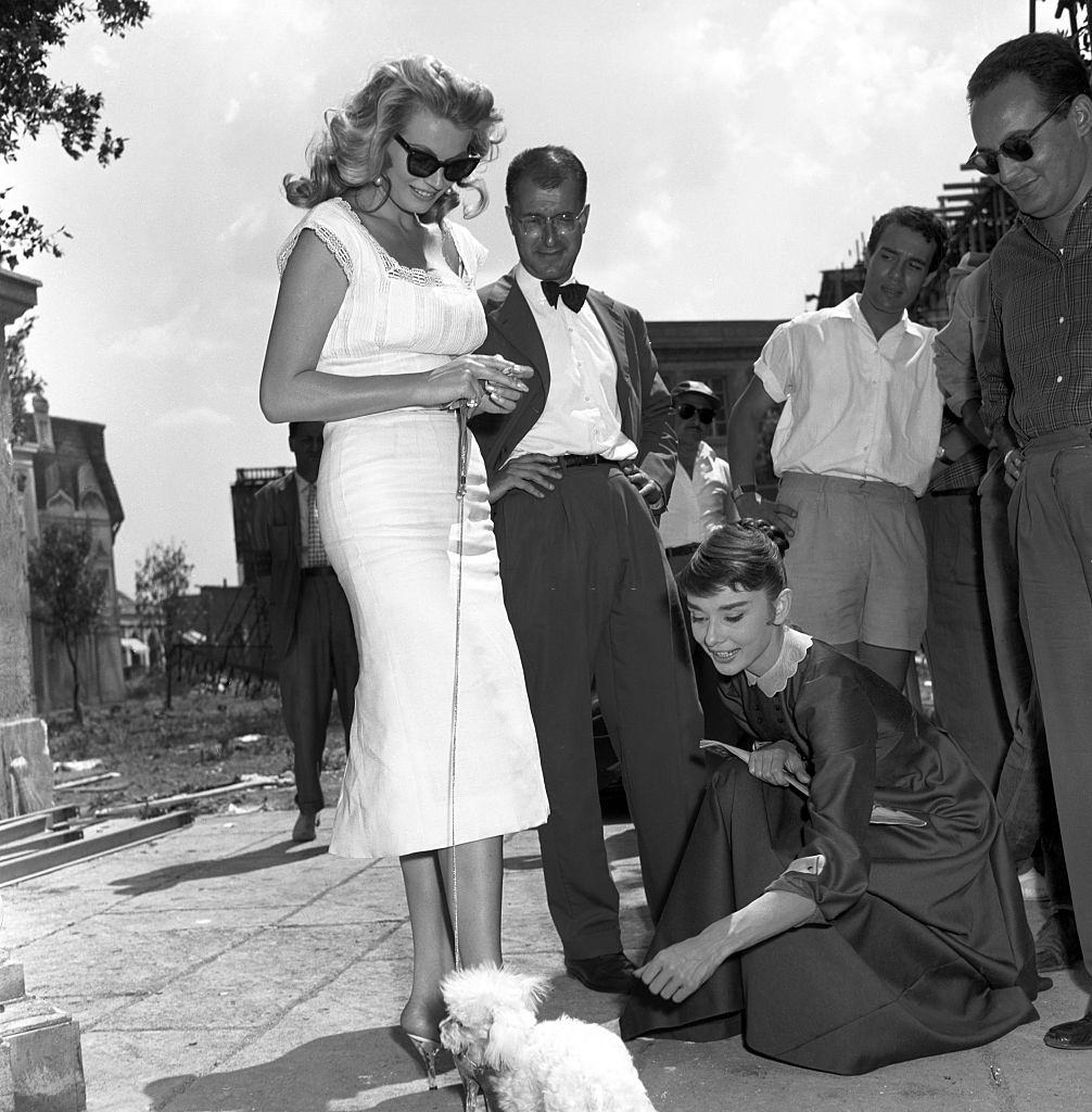 #40 Anita Ekberg walking her dog in the streets of Cinecittà, 1956.