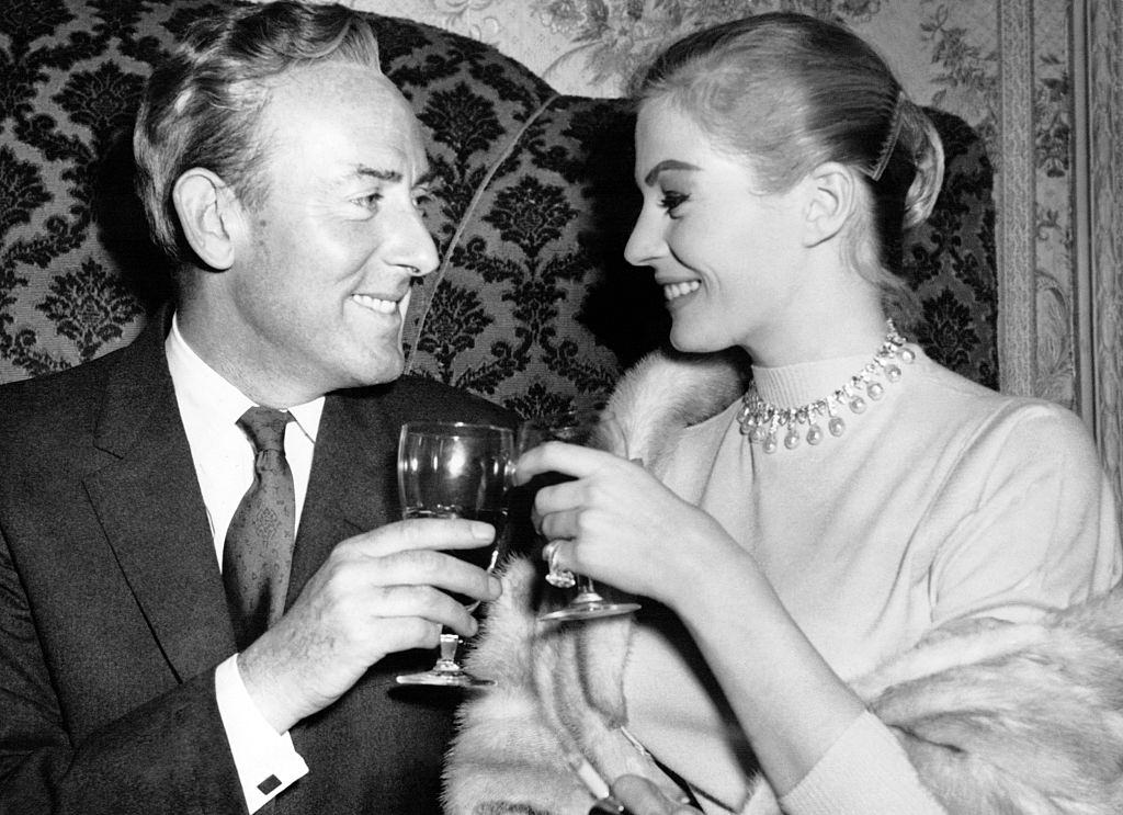 #8 Anita Ekberg and Michael Wilding clinking glasses during a press gala diner at Hamilton Place for Terence Young’s movie ‘Zarak’